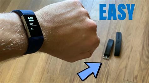 Attaching the new band to the watch is a very simple process. . How to change fitbit charge 2 band